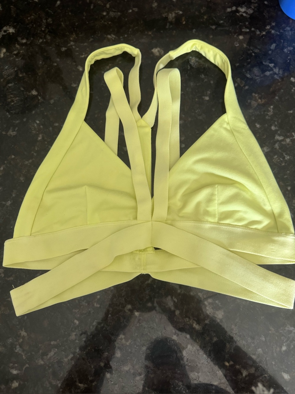 Alo Yoga strappy active bralette in a bright yellow-green colorway